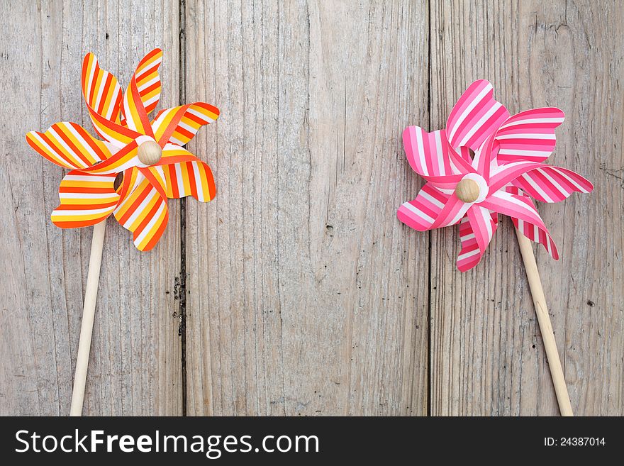 Colorful toy pinwheel on wooden table