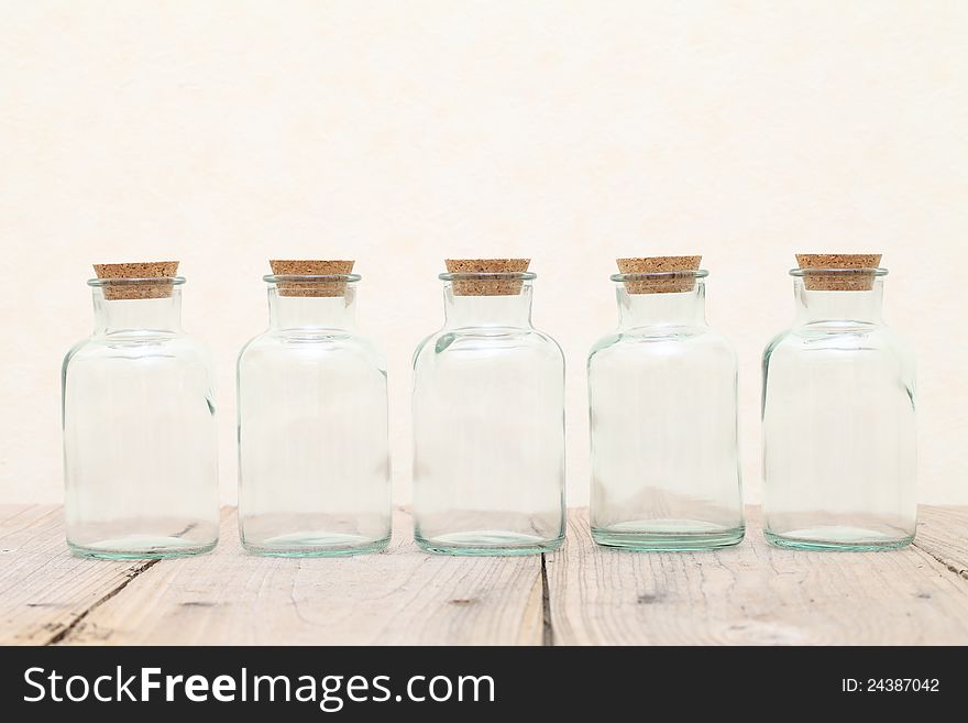 Old glass bottle on wooden table