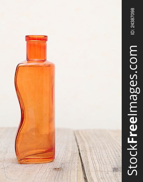 Old glass bottle on wooden table