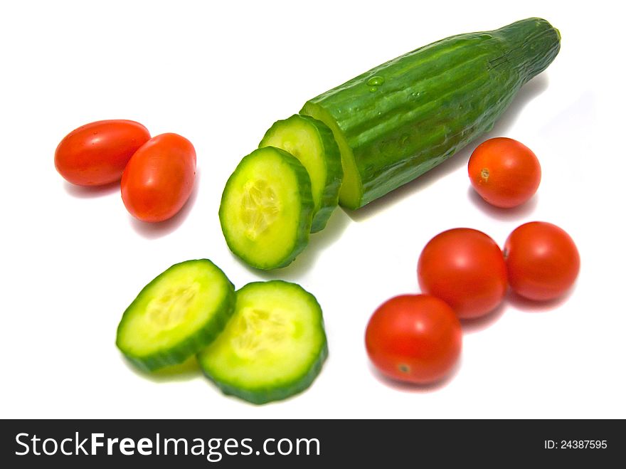 Cucumber and cherry tomatoes on white