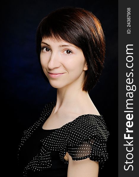 Portrait of beautiful young woman in polka-dot dress