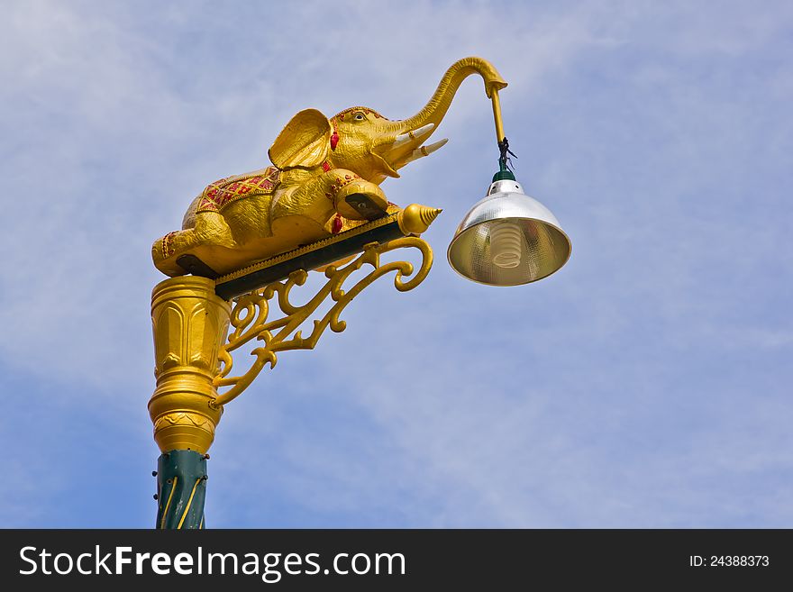 Elephant lamp on sky background