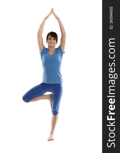 Image of a girl practicing yoga on white