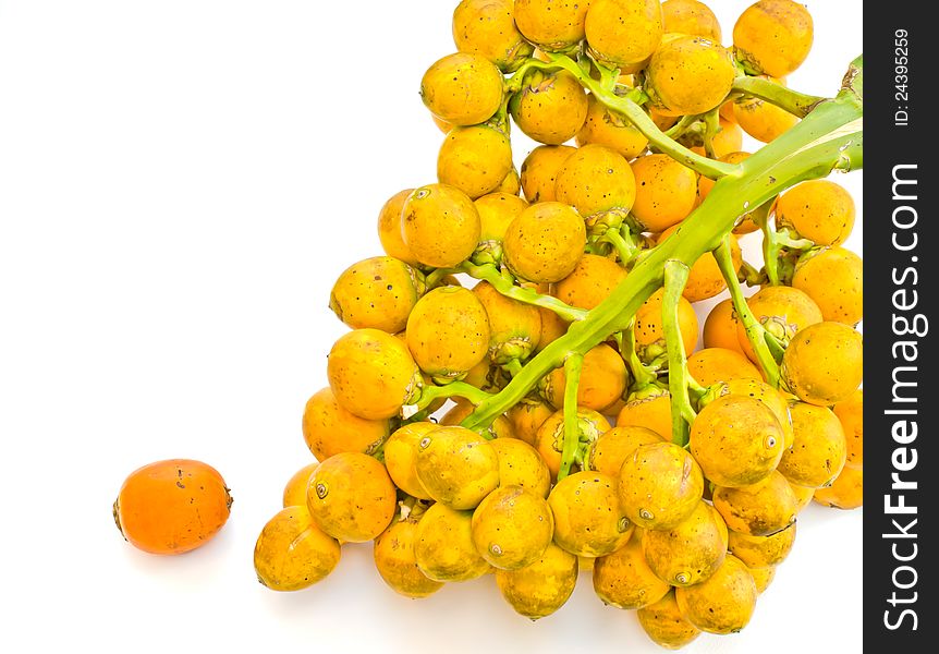 Ripe areca nut on a white background. Ripe areca nut on a white background.