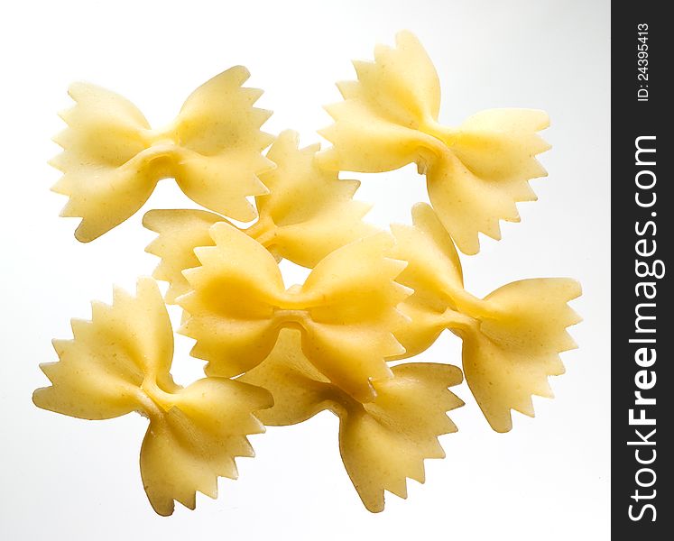 Fusilli. pasta. group of bows on white background