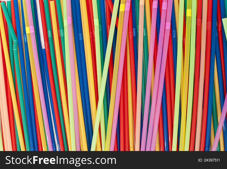 Messy multicolored plastic straws arrangement. Messy multicolored plastic straws arrangement