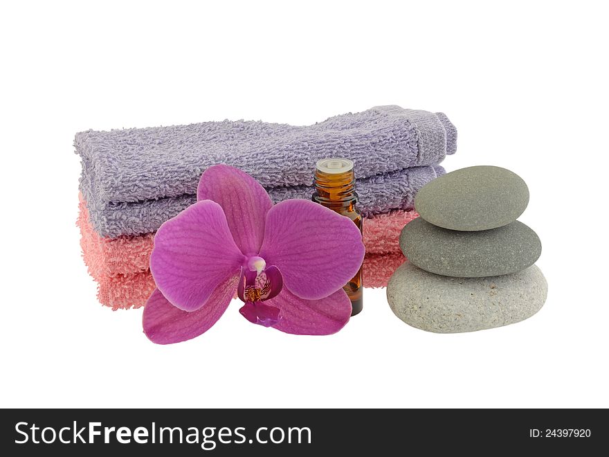 Zen stones with essential oil , flower and towels. Zen stones with essential oil , flower and towels