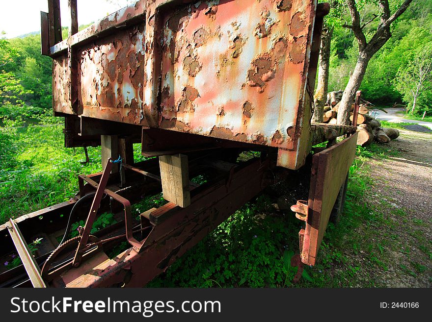 Old rusted trailer for transporting timber