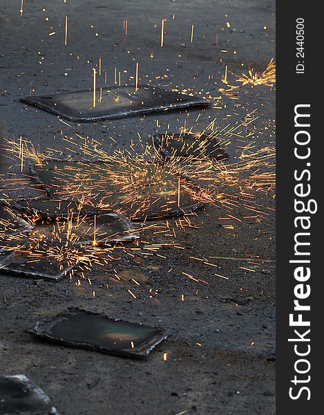 Scrap steel and falling fire from torch. Scrap steel and falling fire from torch