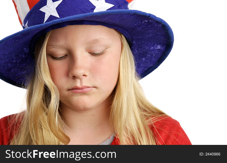 A beautiful young girl wearing a patriotic American hat and looking sad. A beautiful young girl wearing a patriotic American hat and looking sad.