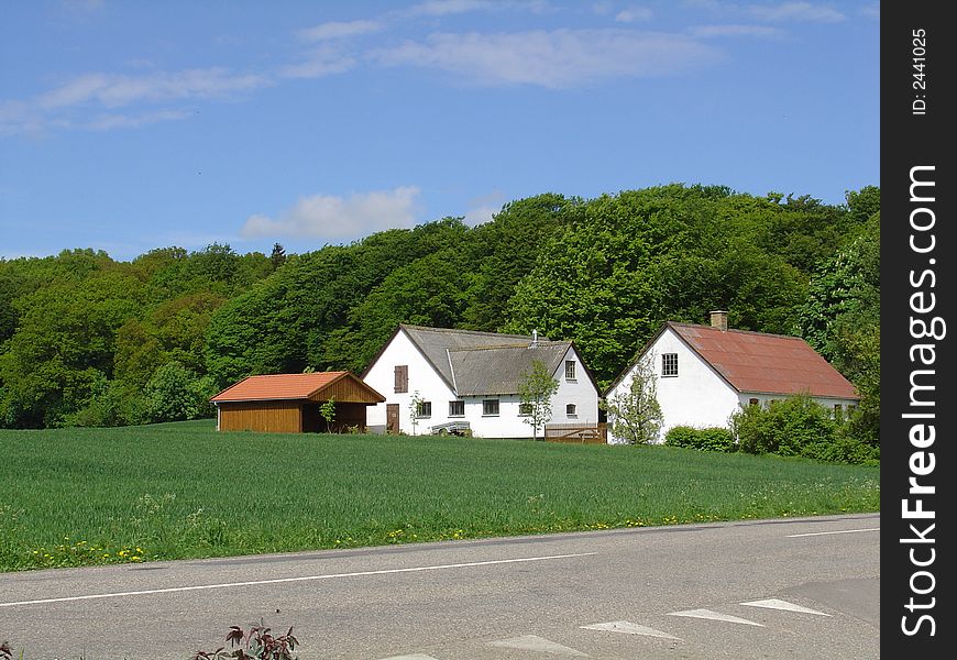 A small farm house close to the woods