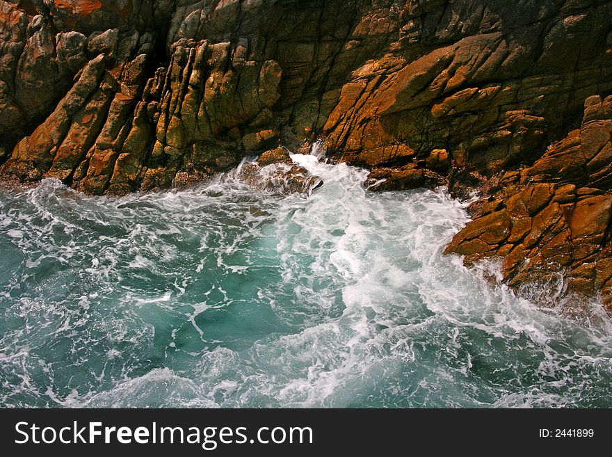 Rocky cliffs and water in Acapulco, Mexico. Rocky cliffs and water in Acapulco, Mexico