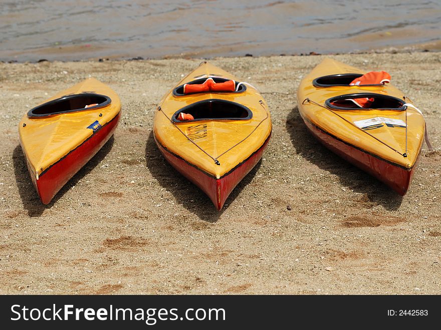 Canoes on the beach and sea water