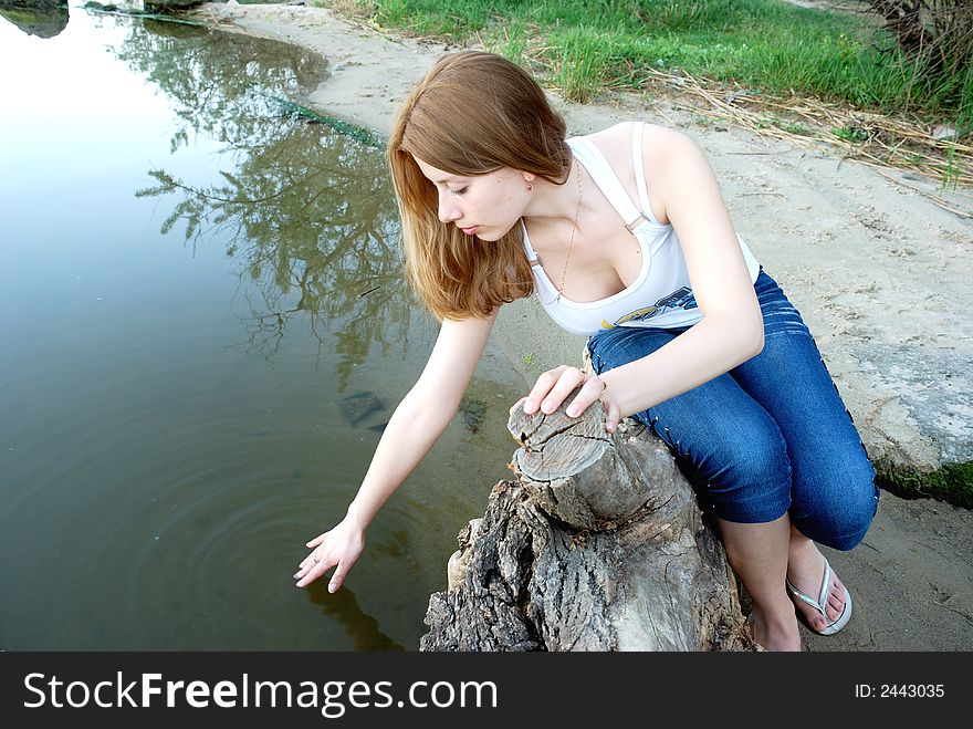 Girl on coast of river