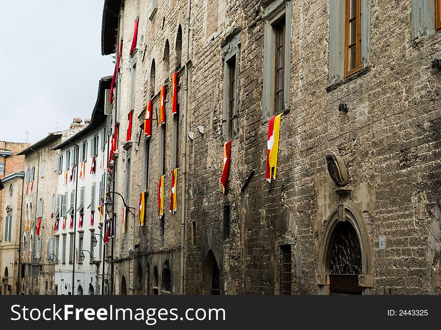 Old facade with the flags of t