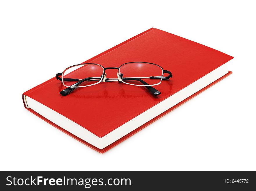 Red book with eyeglasses on a white background + soft shadow