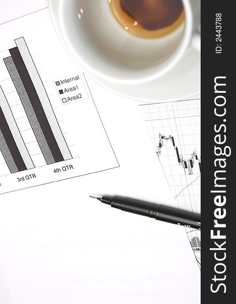 Business still life with chart showing performance over quarterly financial periods. Business still life with chart showing performance over quarterly financial periods.