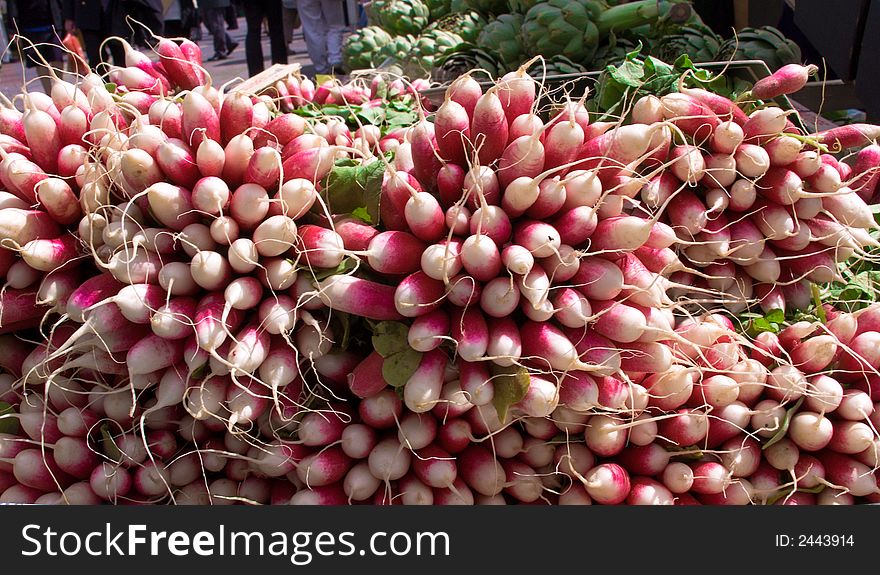 Colourful fresh radishes on a market stall