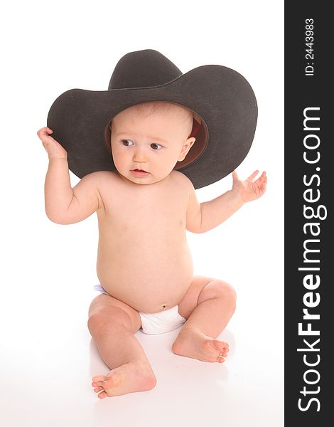 Baby in black felt hat curious. Baby in black felt hat curious