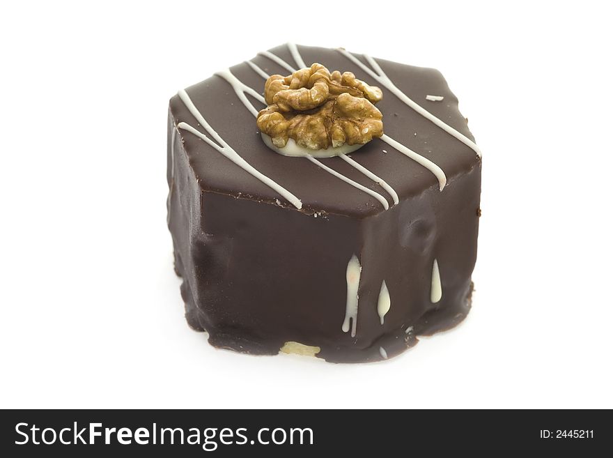 Delicious chocolate cake with walnut isolated on white background.