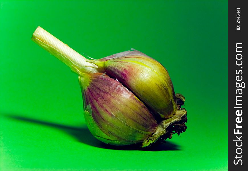 Macro garlic on green fone