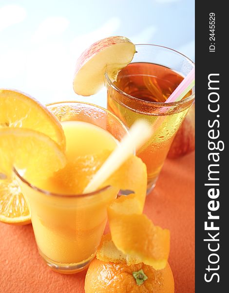 Glass of apple juice and orange juice. Glass of apple juice and orange juice