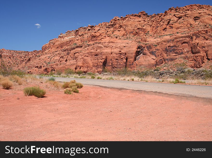 Red rock canyon against a bright blue sky. Open spaces, room for text. Red rock canyon against a bright blue sky. Open spaces, room for text.