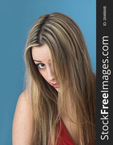 Studio portrait shot of  beautiful youg girl over blue drop