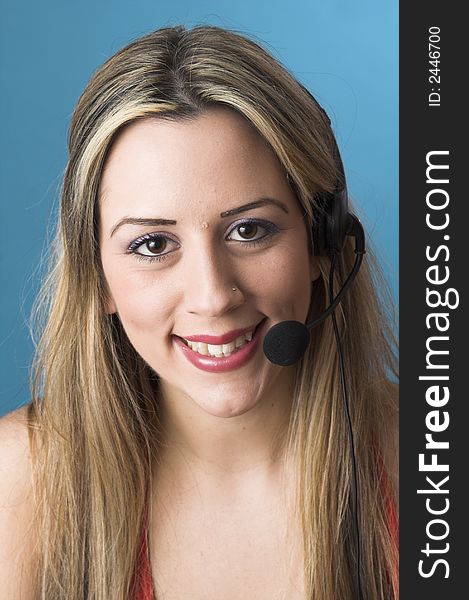 Portrait of receptionist with headset over blue drop