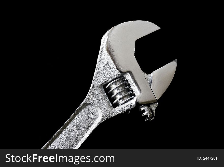 Repair Tool - A Metal Wrench On Black Background