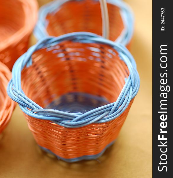 Orange mini basket with blue rim