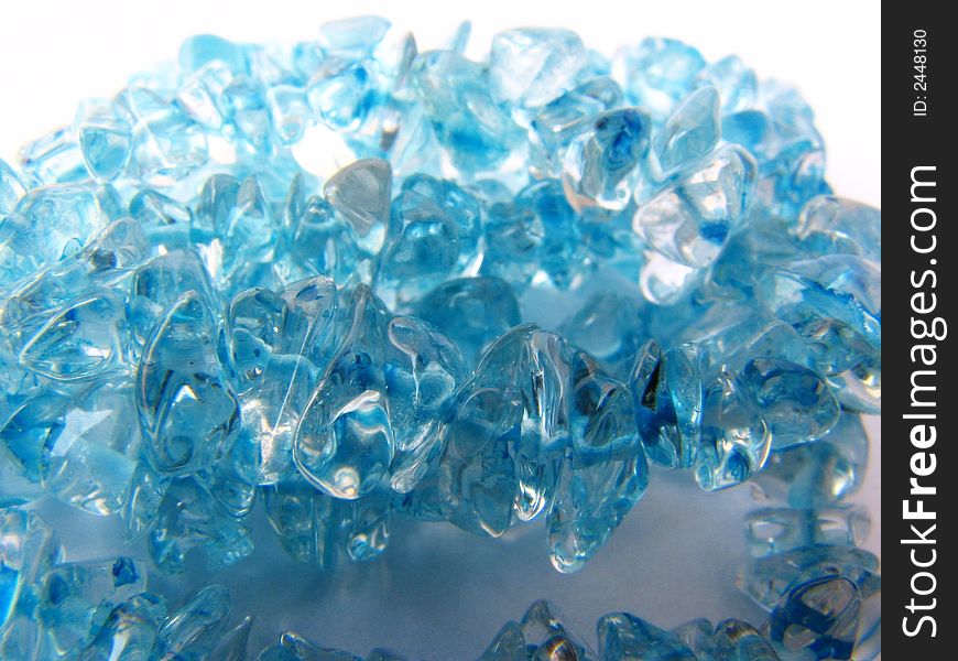 These Glowing blue beads look wonderful in the white background.