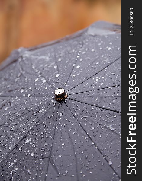 Closeup view of a wet umbrella on a rainy day