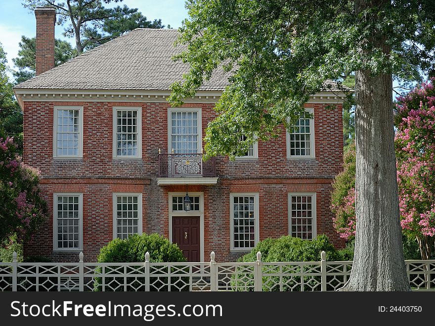 Colonial house in Williamsburg Virginia with white fence. Colonial house in Williamsburg Virginia with white fence