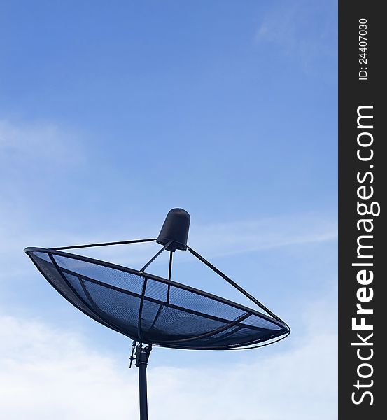 Black satellite dish, blue sky