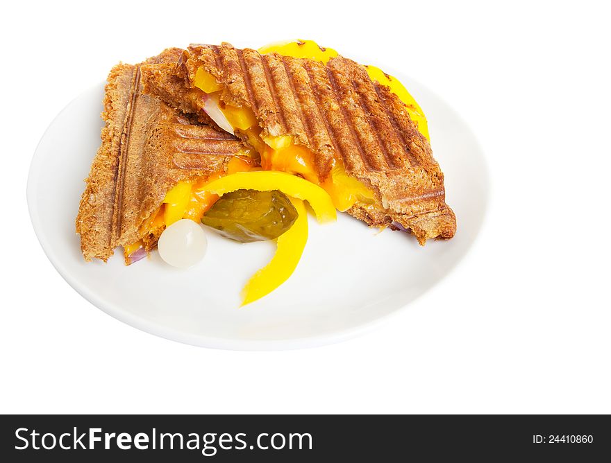 Grilled sandwich or panini with melting cheese,peppers, and  onions, on wholewheat bread.