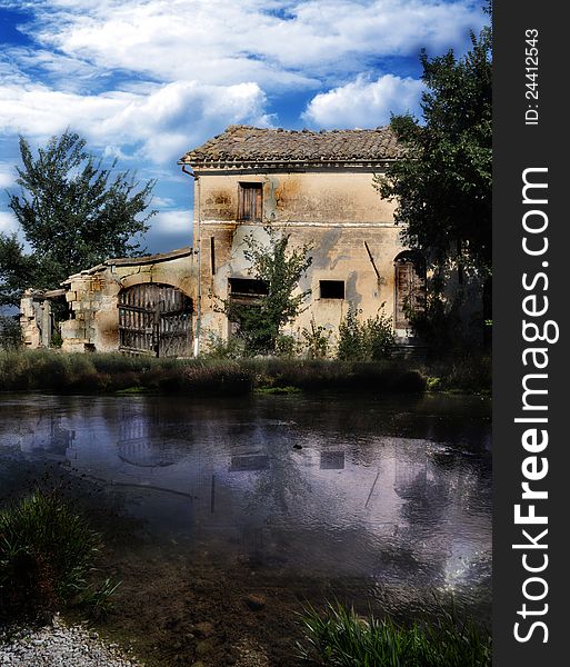 Old house with river and cloudy sky, matte painting. Old house with river and cloudy sky, matte painting