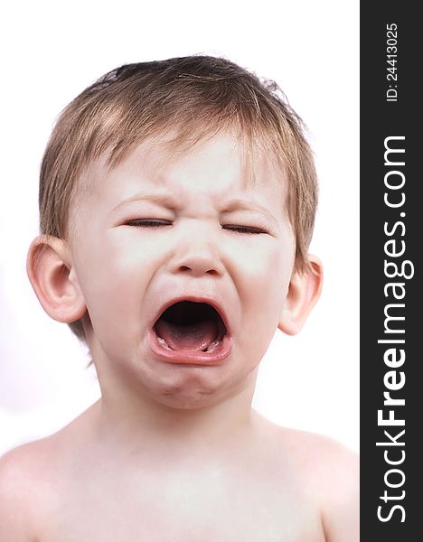 Crying baby boy isolated on white, close up