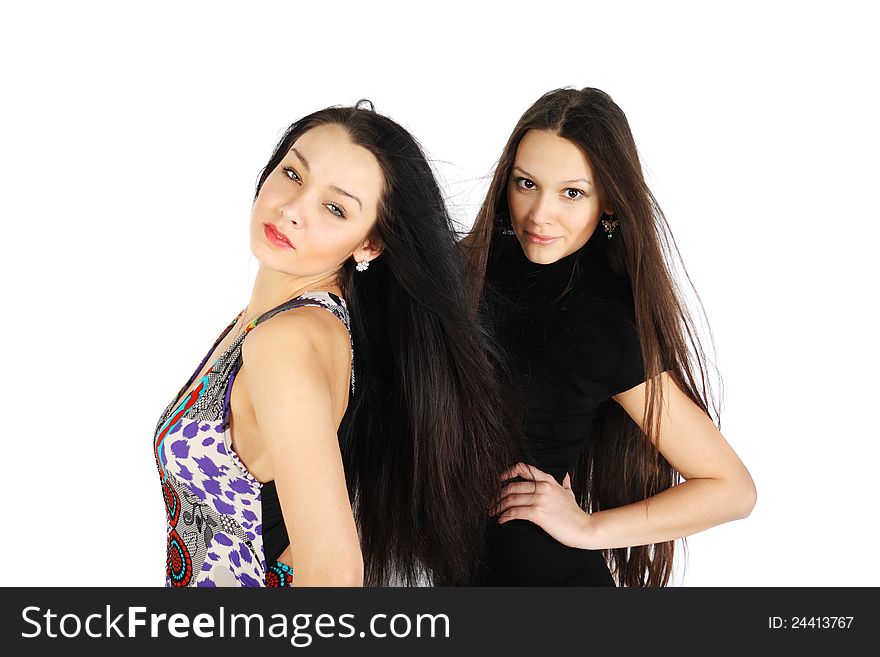 Two brunette girls look at camera