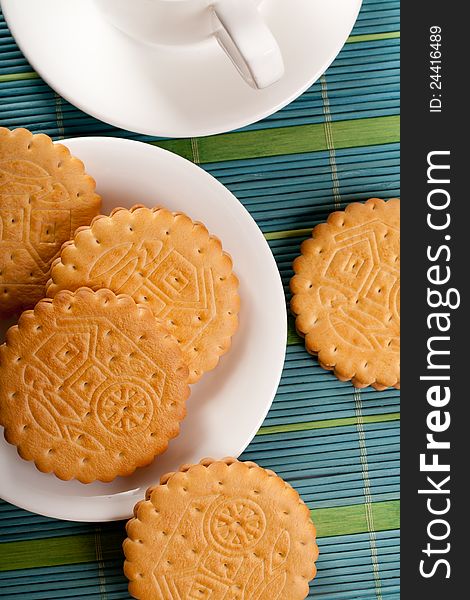 Cookies for coffeebreak with white teapot