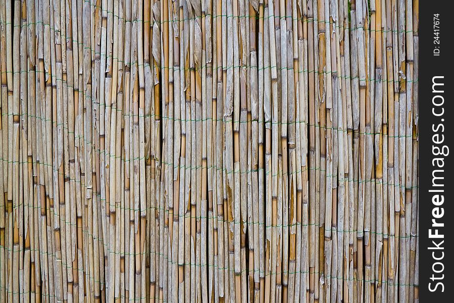 Old bamboo / reed fence as a texture. Old bamboo / reed fence as a texture