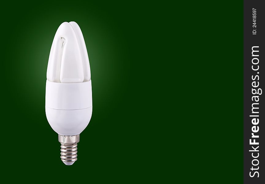 Fluorescent light bulb isolated on green background. Fluorescent light bulb isolated on green background.