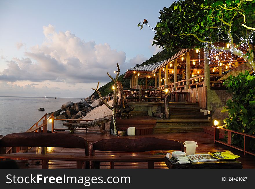 A scenic restaurant at nightfall by the sea