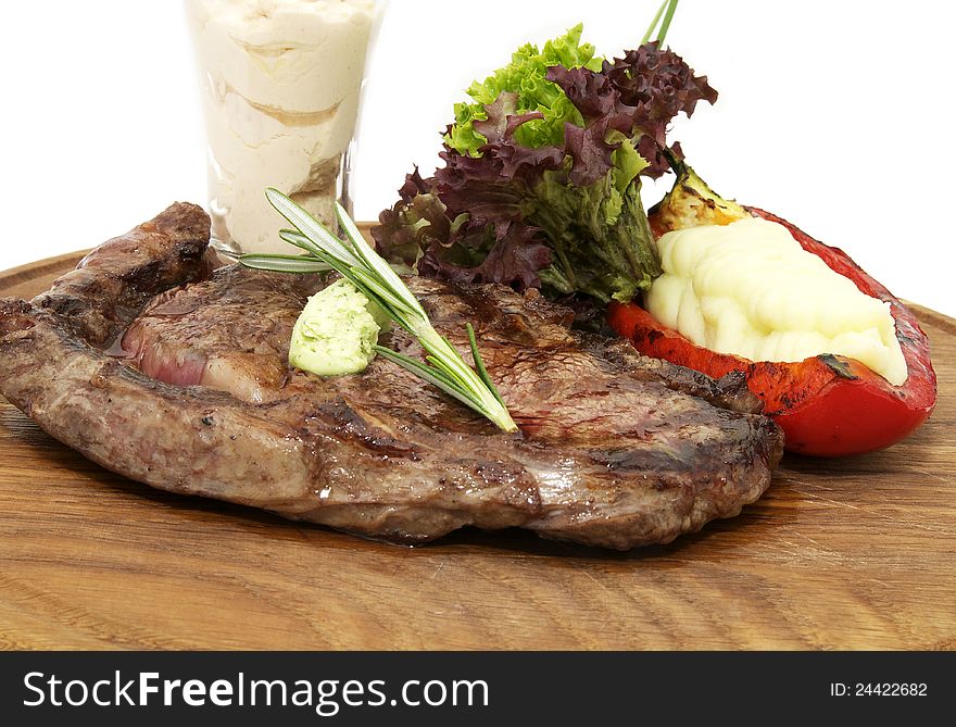 Steak and mashed potatoes with gravy on a white background. Steak and mashed potatoes with gravy on a white background