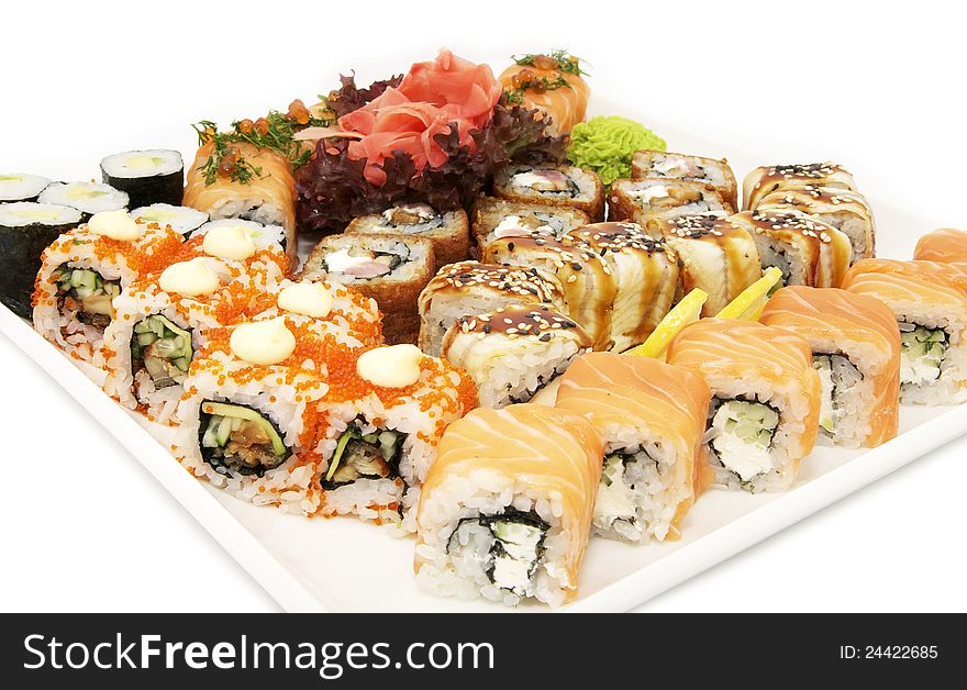 A huge plate of sushi on white background