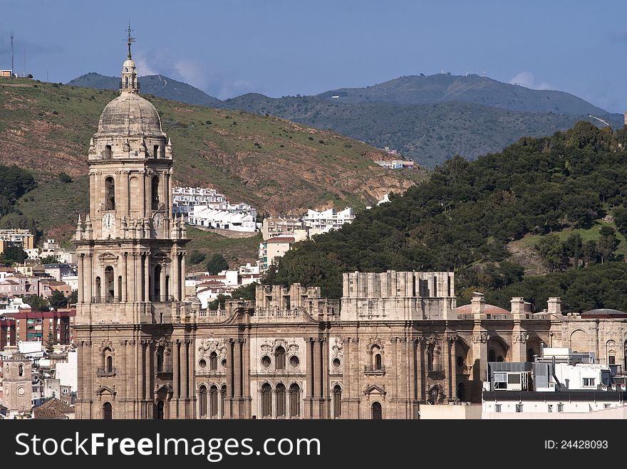 Views of Malaga cathedral with mountains in the background. Views of Malaga cathedral with mountains in the background