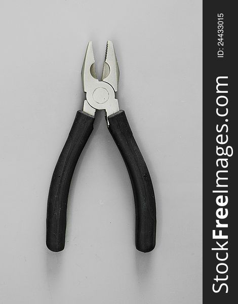 Pliers  on white with black handle