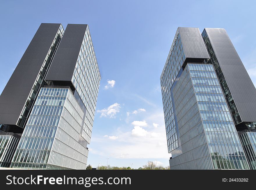 Twin towers in front of Baneasa exhibition center in Bucharest - the capital of Romania. Twin towers in front of Baneasa exhibition center in Bucharest - the capital of Romania