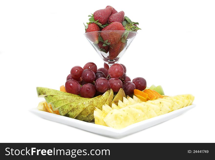 Dish with a fruity dessert on a white background