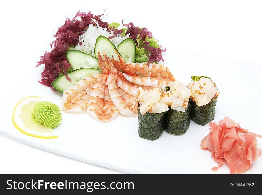 Sushi and shrimp salad in a restaurant on a white background
